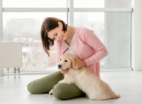 Woman petting little dog — Stock Photo, Image
