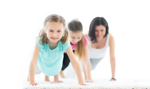 Pushups performed by girls and woman — Stock Photo, Image