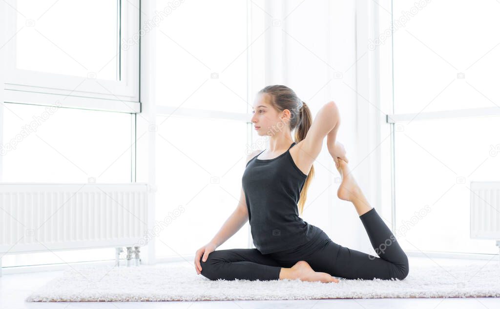 Cute girl doing physical exercises