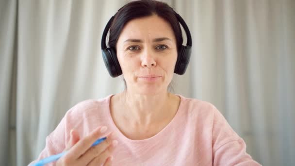 Teacher in headphones during online lesson — Stock Video