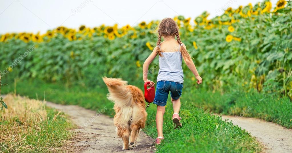 Little girl with golden retriever