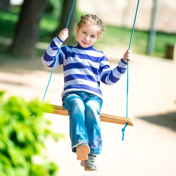 Little girl on swing — Stock Photo, Image