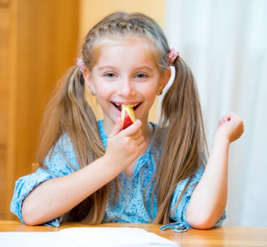 Schoolgirl eating apple clipart