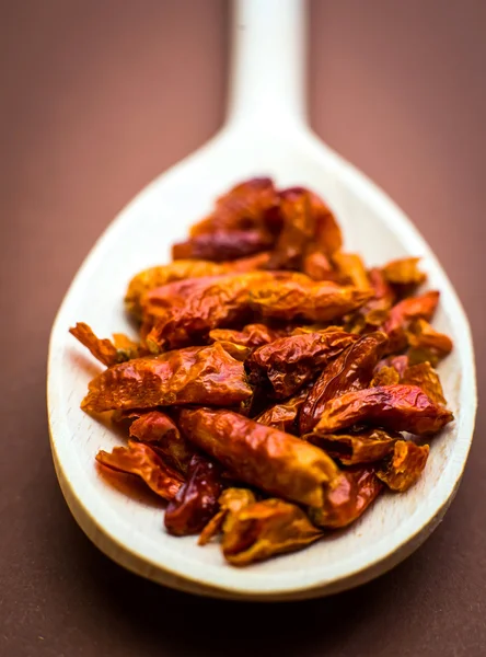 Chili in wooden spoon — Stock Photo, Image