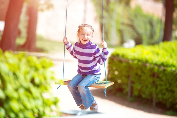 Little girl on swing — Stock Photo, Image