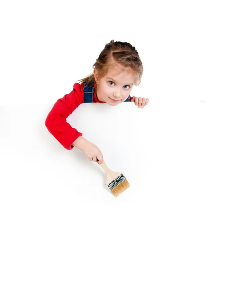 Menina com um pincel e banner branco — Fotografia de Stock