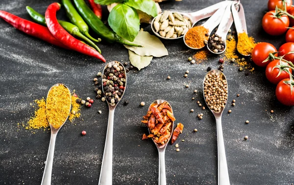 Spoons with spices — Stock Photo, Image