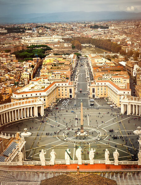 Famous Saint Peters Square in Vatican and aerial view of the city, Rome, Italy.