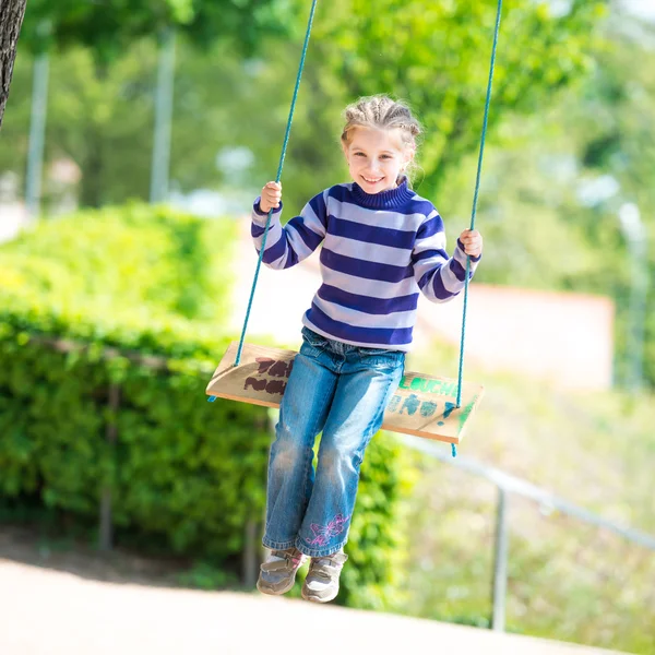 Little girl on swing — Stock Photo, Image