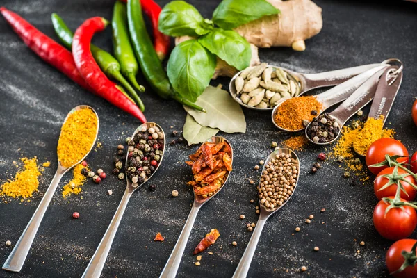 Spoons with spices — Stock Photo, Image