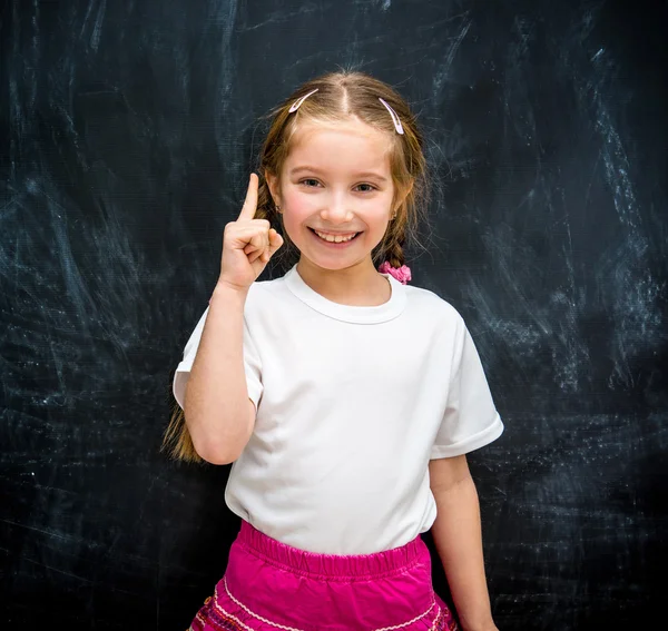 Kleines Mädchen hob einen Finger nach oben — Stockfoto