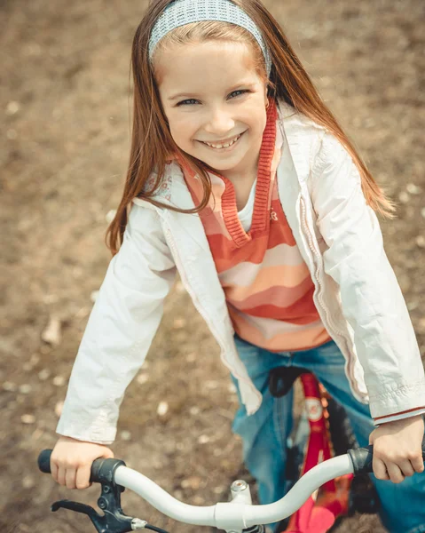 Little girl on a bicycle — Stock Photo, Image