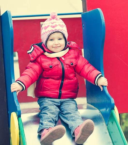 Little girl riding a roller coaster — Stock Photo, Image