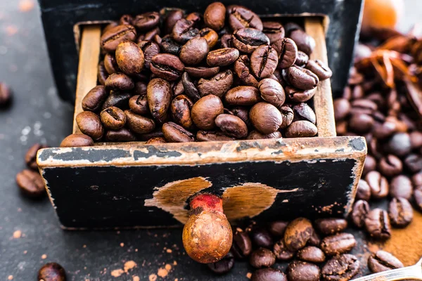 Old wooden box with coffee beans — Stock Photo, Image