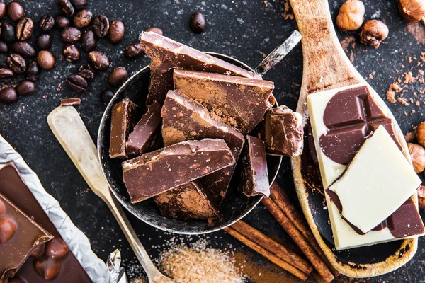 Chocolate, cocoa and spices in on a table — Stock Photo, Image