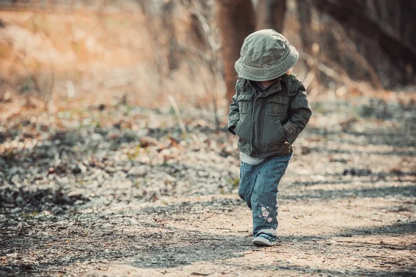 Funny little child walking in the woods — Stock Photo, Image