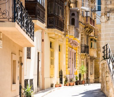 typical narrow street in Valletta clipart