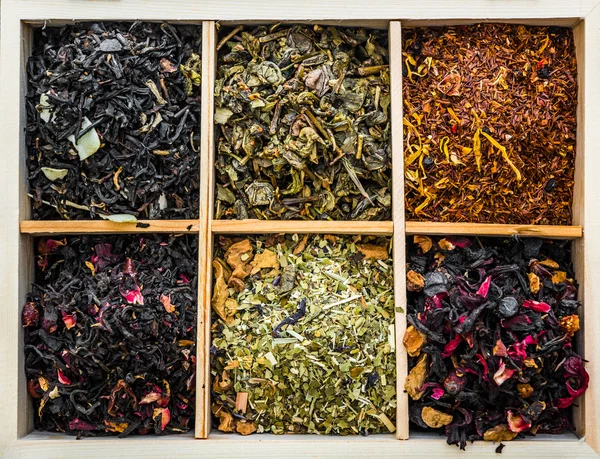 Dry teas in wooden box — Stock Photo, Image