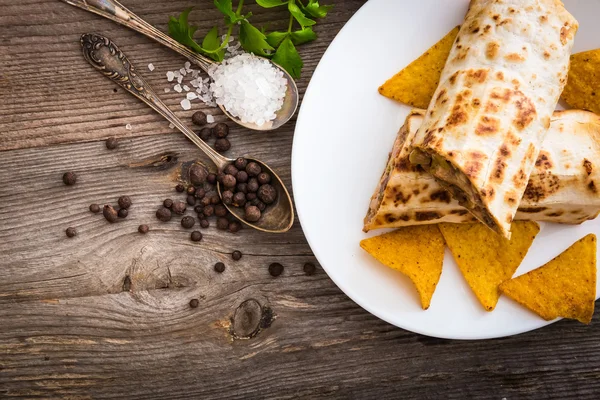 Burrito with chips and spices — Stock Photo, Image