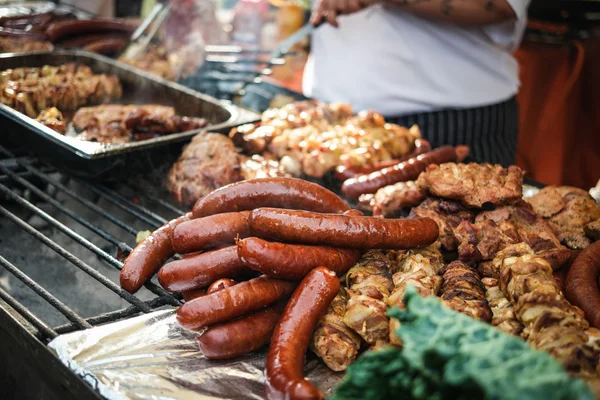 Sausages and cooking meat — Stock Photo, Image