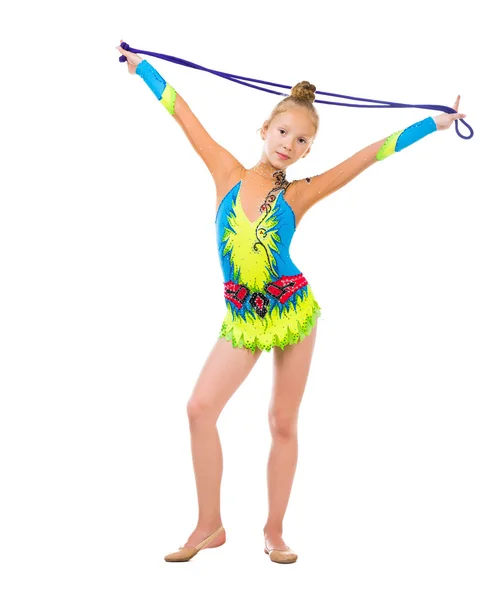 Little gymnast holding a skipping rope over her head — Stock Photo, Image