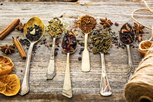 Dry teas on wooden background — Stock Photo, Image