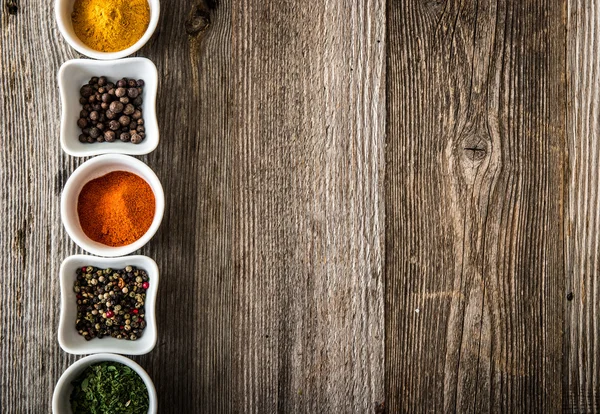 Spices in bowls in horizontal row — Stock Photo, Image