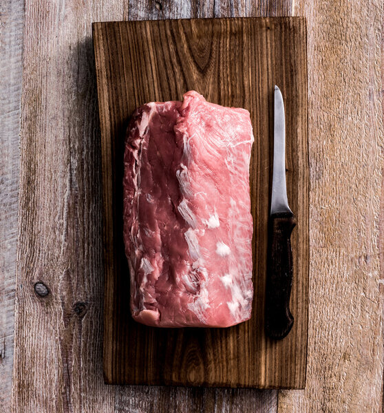 raw meat on cutting board