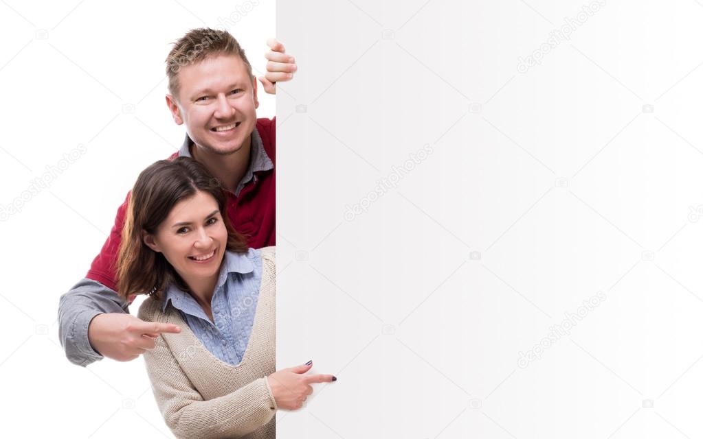 man adm woman pointing at empty blank
