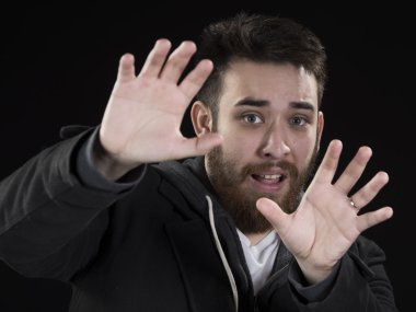 Afraid Young Man with Hands Up clipart