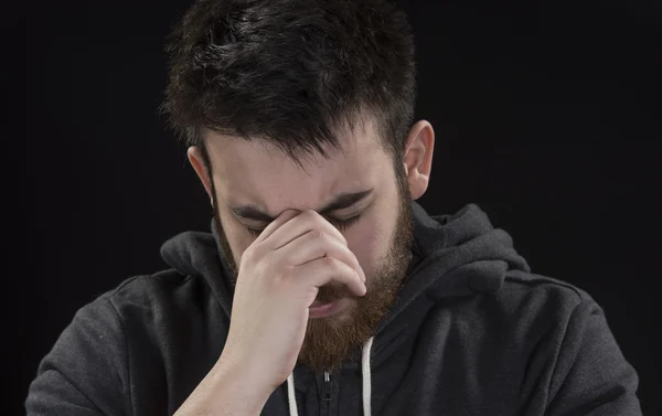 Worried Goatee Young Man with Hand on Face — Stock Photo, Image