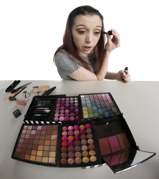 Young Woman with Tray of Make Up Applying Mascara — Stock Photo, Image