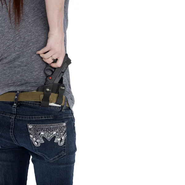 Woman Pulling her Hand Gun from Hip Holster — Stock Photo, Image