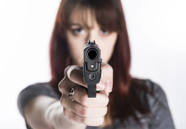 Young Woman Pointing a Gun at the Camera — Stock Photo, Image