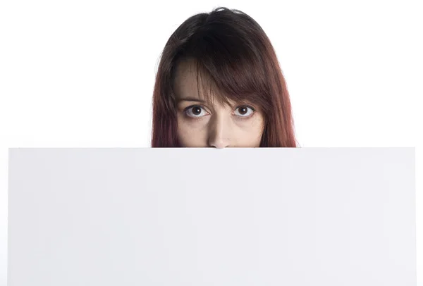 Young Woman Peeking Behind White Cardboard — Stock Photo, Image