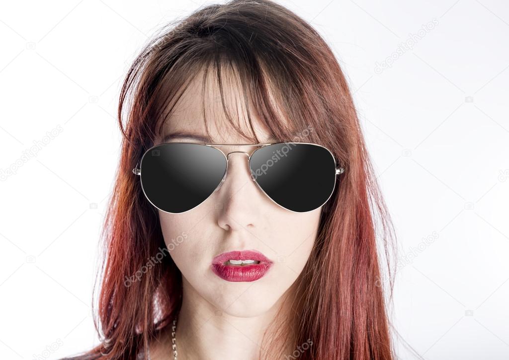 Close Up of Young Woman Wearing Sunglasses