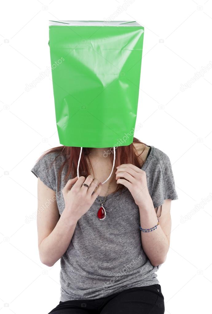 Young Woman with Green Shopping Bag on Head