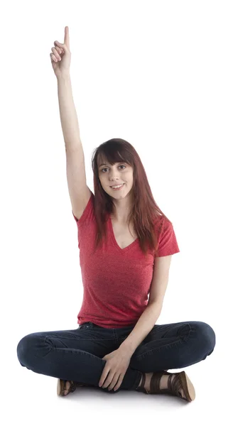 Mujer sentada levantando su brazo con el signo número uno —  Fotos de Stock