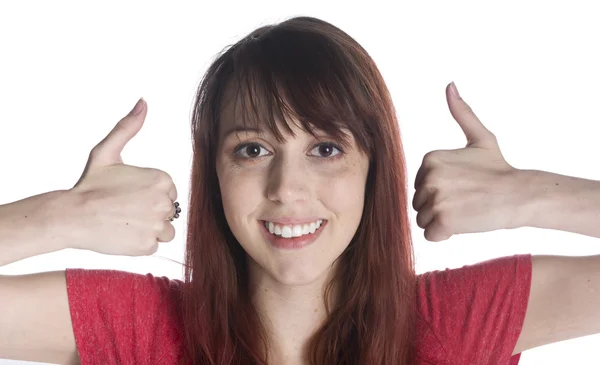 Усміхнена жінка показує великі пальці ближче до її обличчя — стокове фото