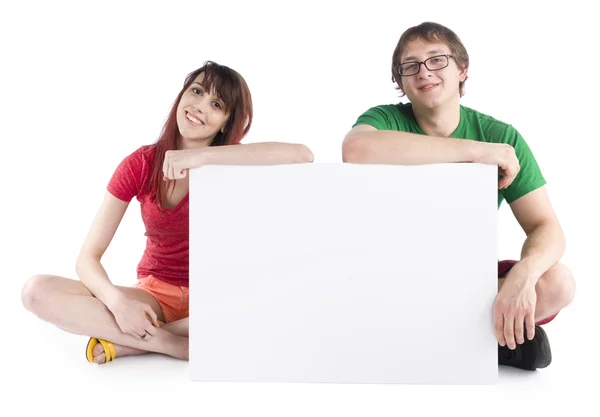 Sitting Couple with Empty White Cardboard — Stock Photo, Image