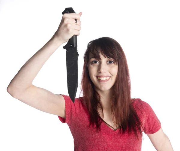 Lachende vrouw met mes Camera kijken — Stockfoto