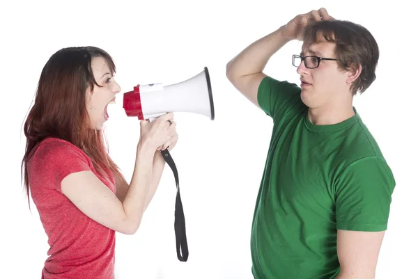 Mujer gritando a su hombre con megáfono Imagen De Stock