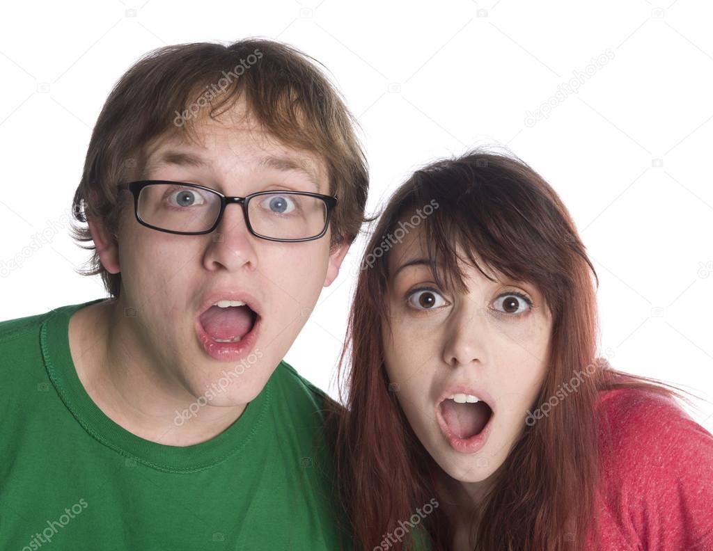 Shocked Couple with Mouth Open Looking at Camera