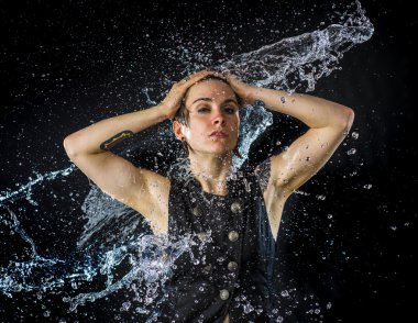 Sensual Young Woman in Water Splashes