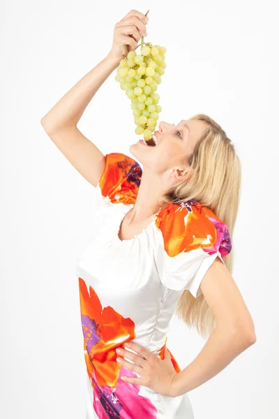 Eva eating grapes — Stock Photo, Image