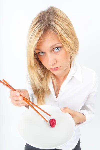 Raspberries with chopsticks — Stock Photo, Image