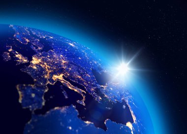 Dünya Gezegeni üzerinde gün doğumunun resmi, Avrupa şehir ışıkları görünür. Enerji tüketimi kavramı. NASA tarafından desteklenen bazı unsurlar.