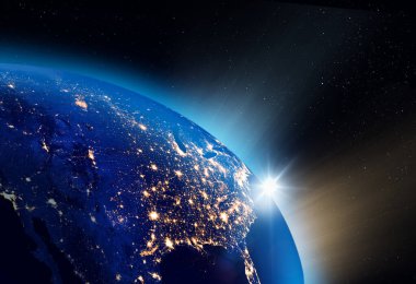 Kuzey Amerika şehir ışıkları üzerinde gün doğumunun görüntüsü görülebilir. Dijital iletişim konsepti. NASA tarafından desteklenen bazı unsurlar.