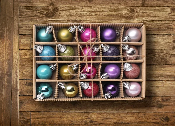 Colorful Xmas balls on old wood background — Stock Photo, Image