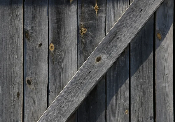 OID grå vittrade ladugårdsdörr detalj — Stockfoto